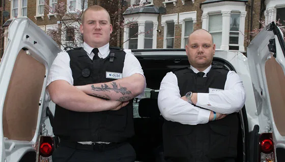 Bailiffs looking like police officers